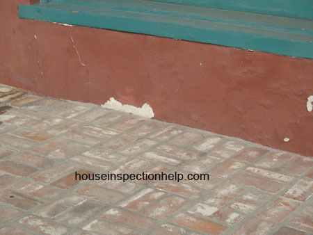 missing exterior wall stucco from water damage