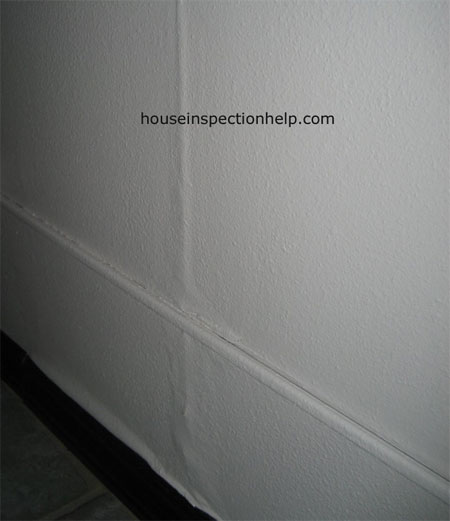 vertical interior drywall water damage probably caused from roof leaks