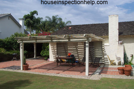 view from backyard of house with patio cover