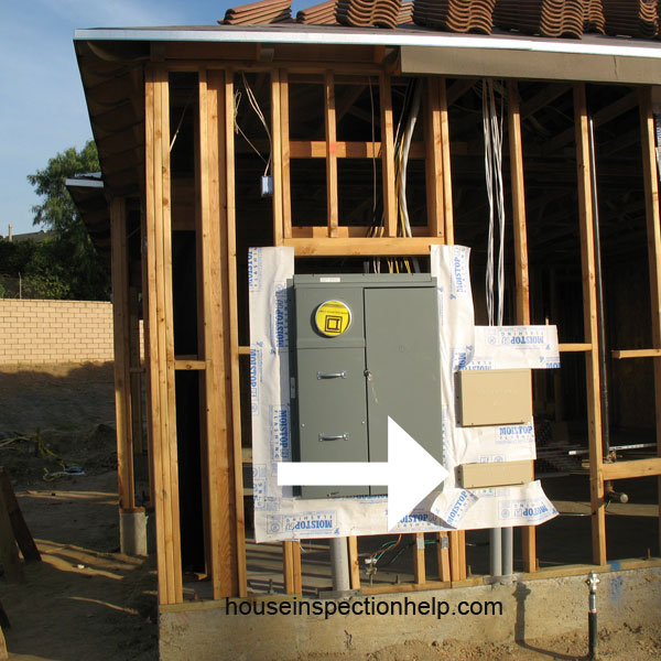 cable tv box next to electric meter on framed house